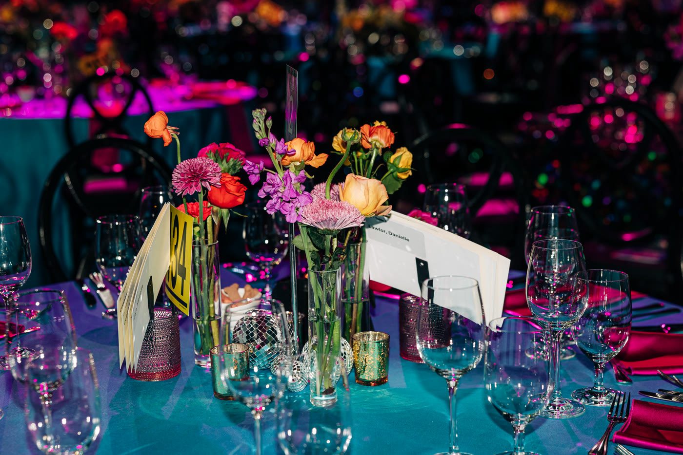 Bud vases in teal glass, up close