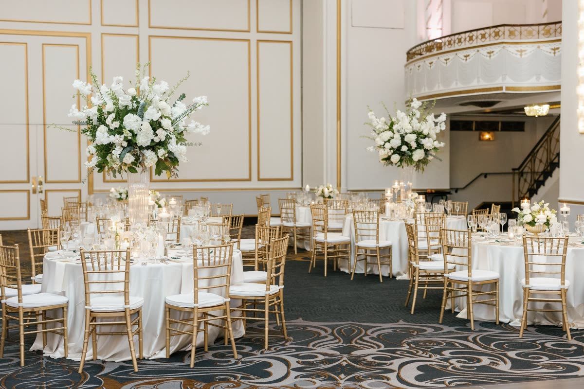 Grand ballroom with towering white centerpieces