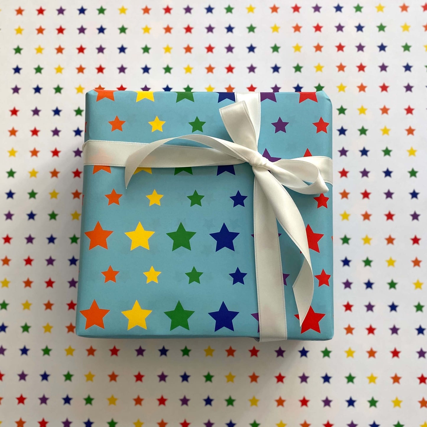 Rainbow Stars Wrapping Paper: Rolls of 3 Sheets (Case of 3 Rolls)