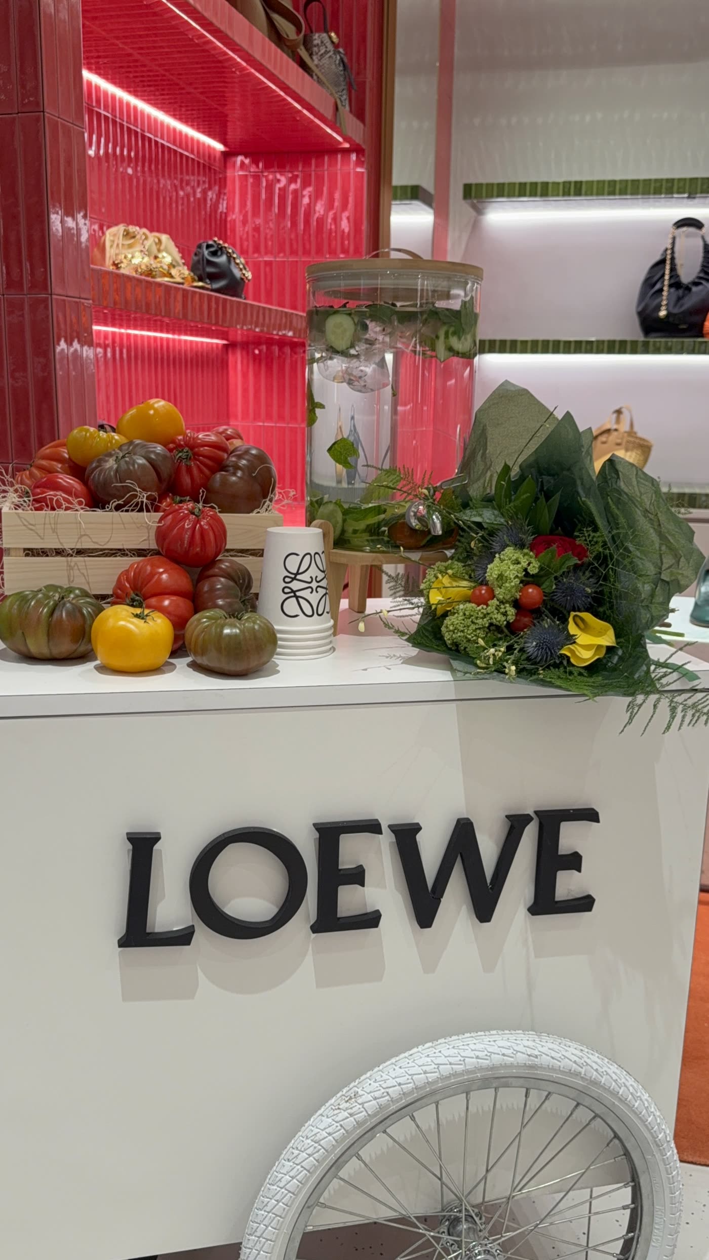 Market cart styled with heirloom tomatoes and florals for LOEWE