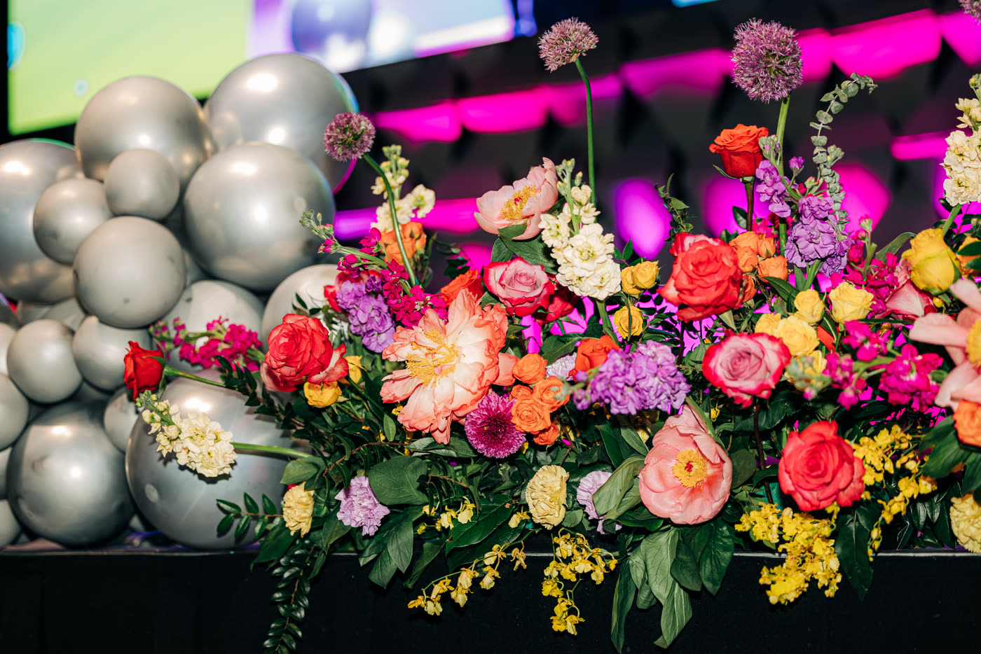 Silver disco-ball centerpiece with technicolor florals