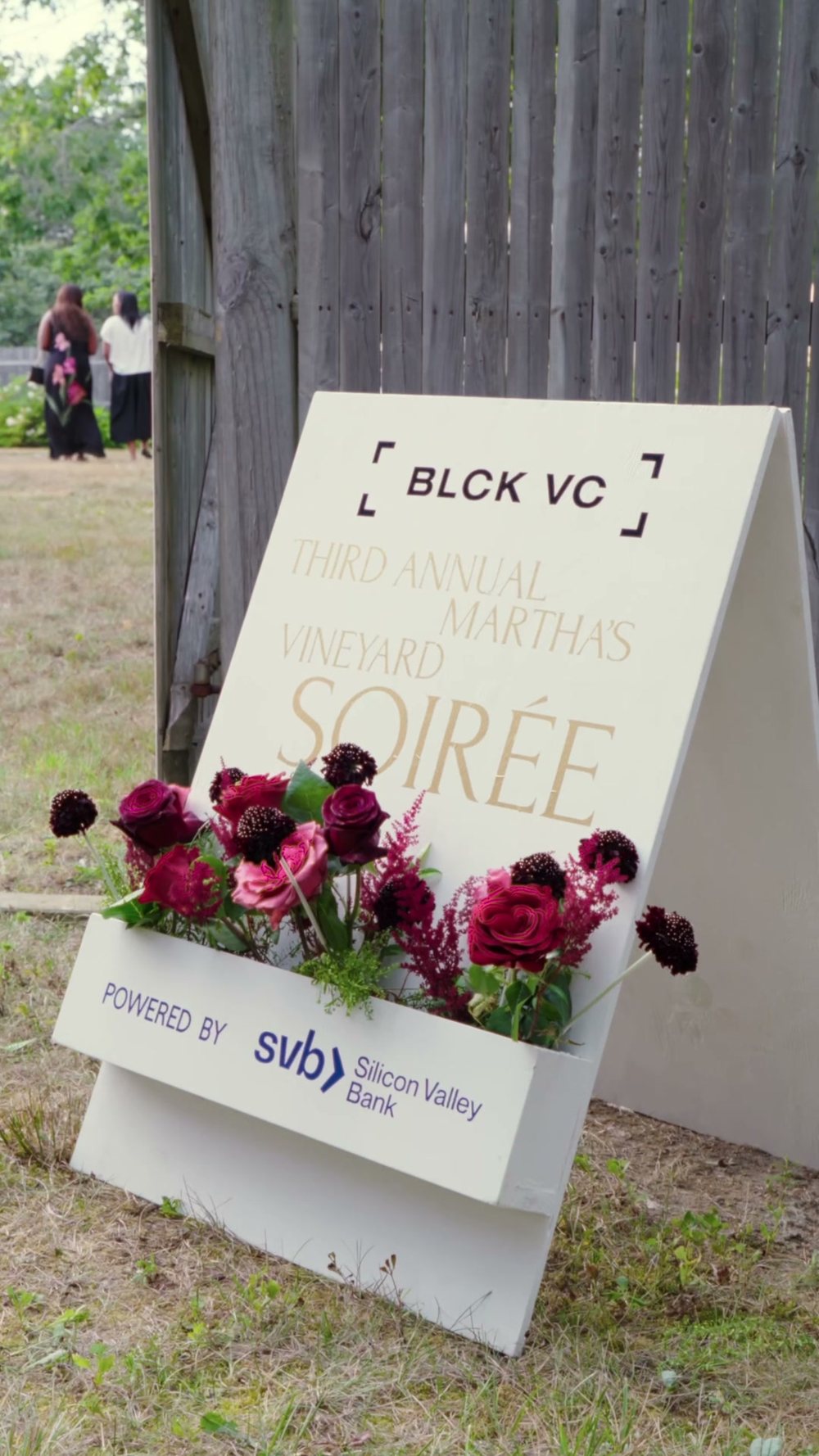 The BLCK VC soir&eacute;e sign with deep red roses