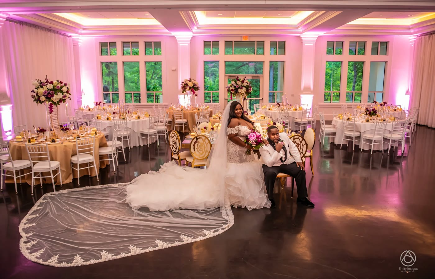 The Lakeview Pavilion reception glowing pink, the veil trailing across the floor
