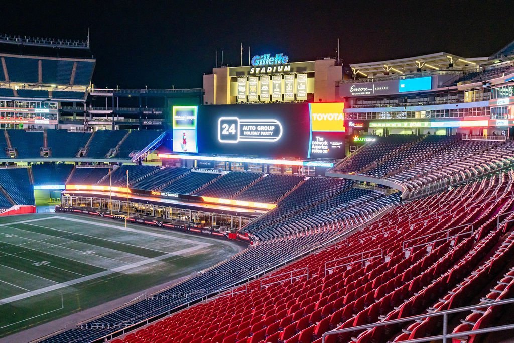 Gillette Stadium at night, lit for match day