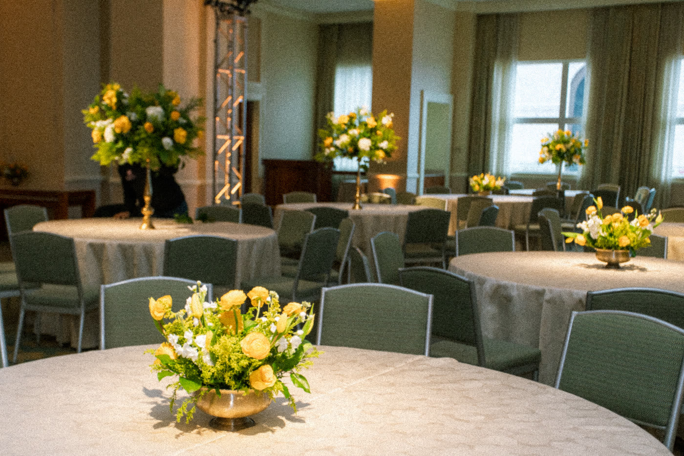 Corporate gala ballroom washed in gold and yellow