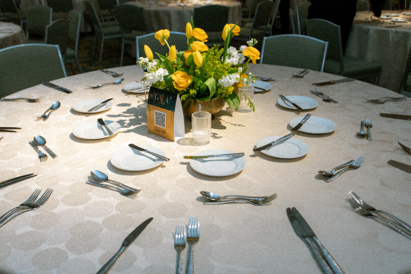 A golden centerpiece on a set gala table