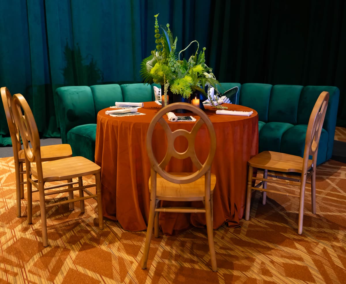 Emerald velvet lounge with rust tablescape, set and waiting