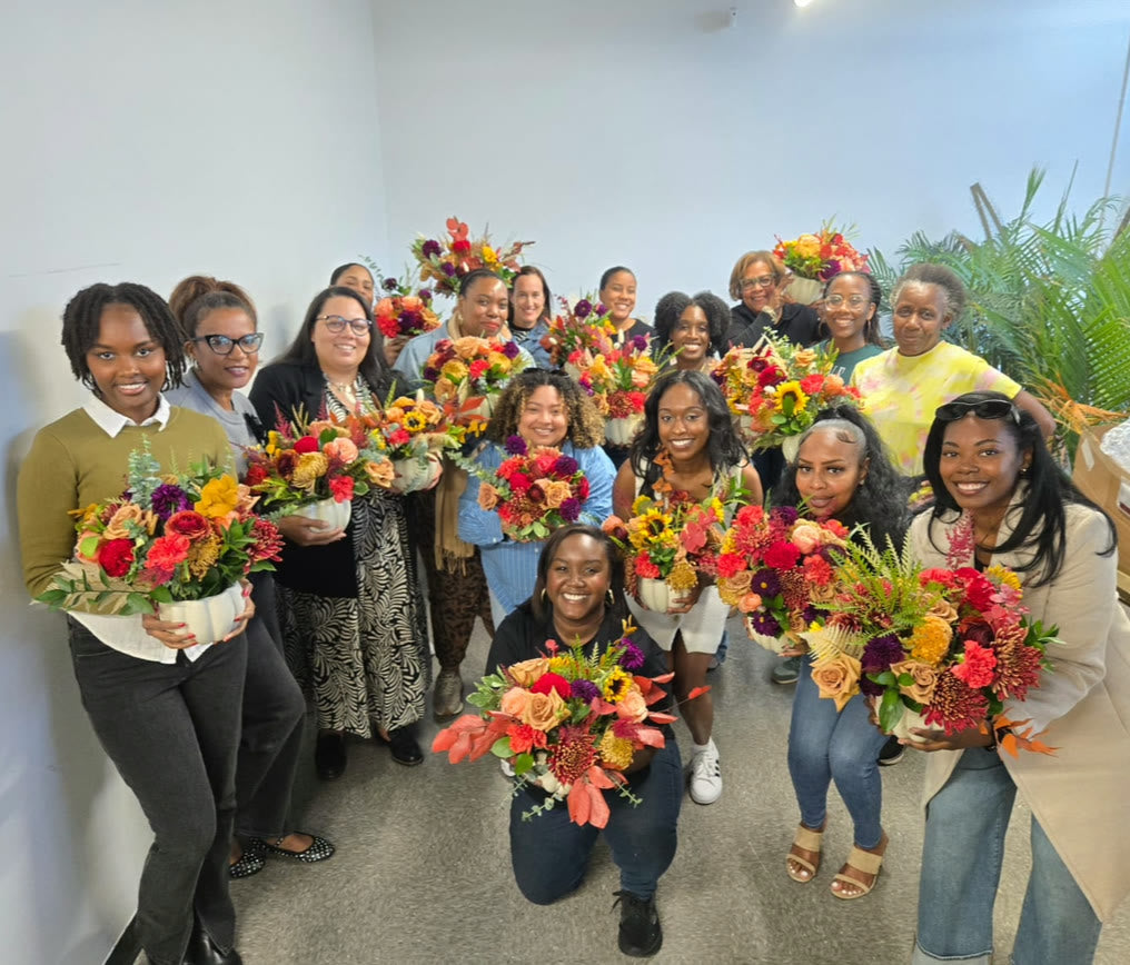 A full workshop class at the River Street studio, arrangements in hand