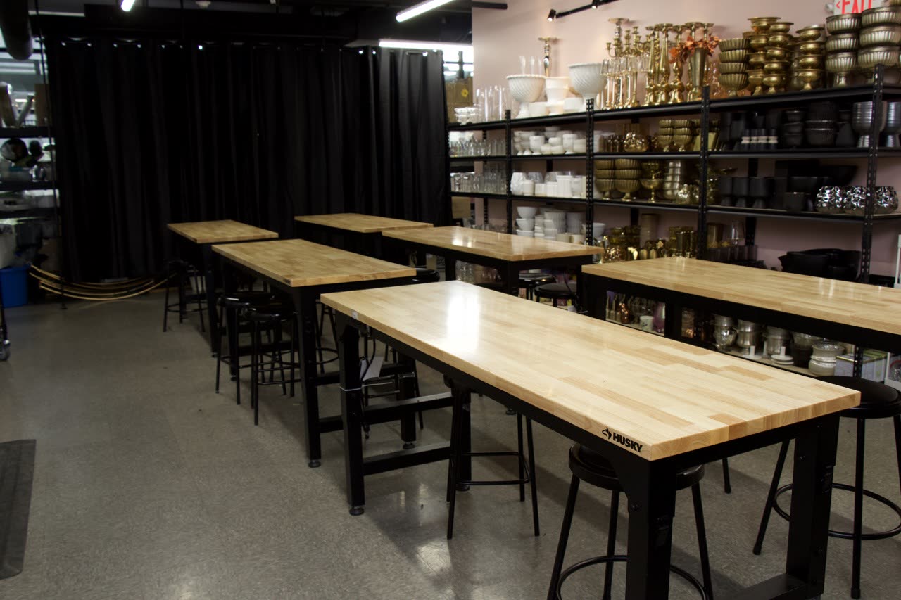 Butcher-block workbenches set for a session at the studio